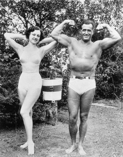 Actress Dorothy Wilson Posing with Charles Atlas